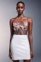 Haut dos nu sans manches à pompons et chaîne de poitrine