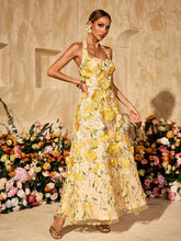 Robe longue dos nu à fleurs brodées
