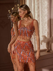 Ensemble jupe fendue à franges et chaîne de cristaux orange