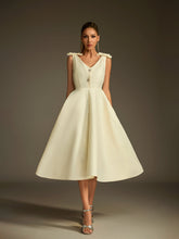 Robe midi boutonnée à col V et nœud