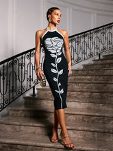 Robe midi bandage à fleurs dos nu