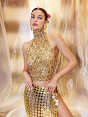 Haut à paillettes et cristaux dorés