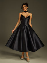 Robe midi en satin à fines bretelles