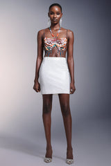 Haut dos nu sans manches à pompons et chaîne de poitrine