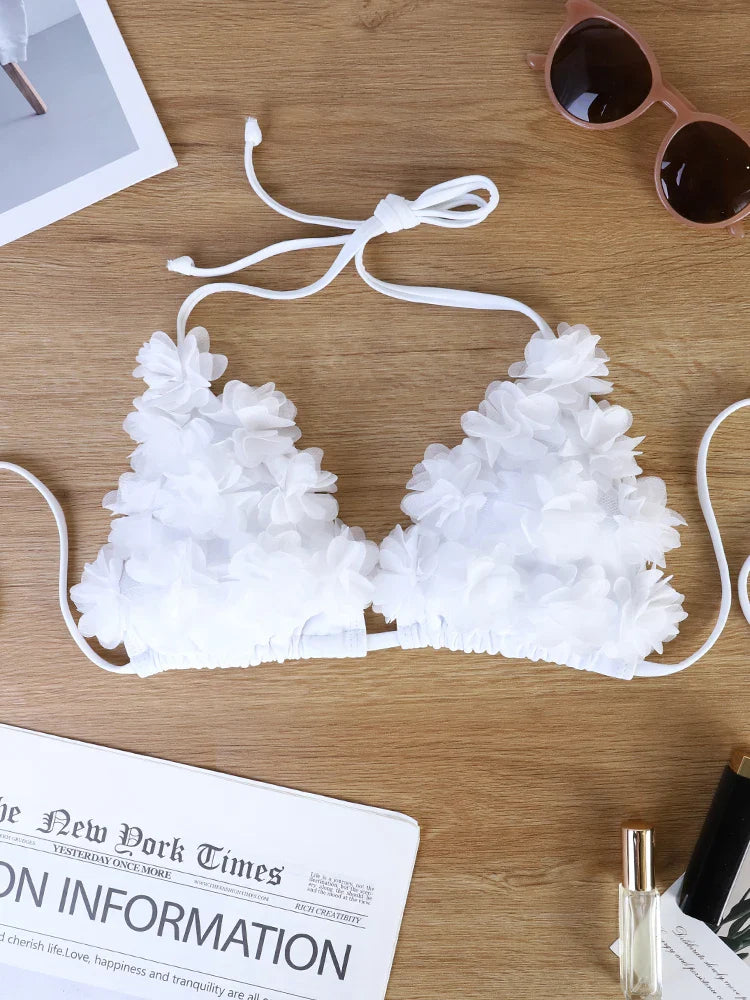 French-style romantic white floral bikini, pure and alluring, flattering and photogenic.