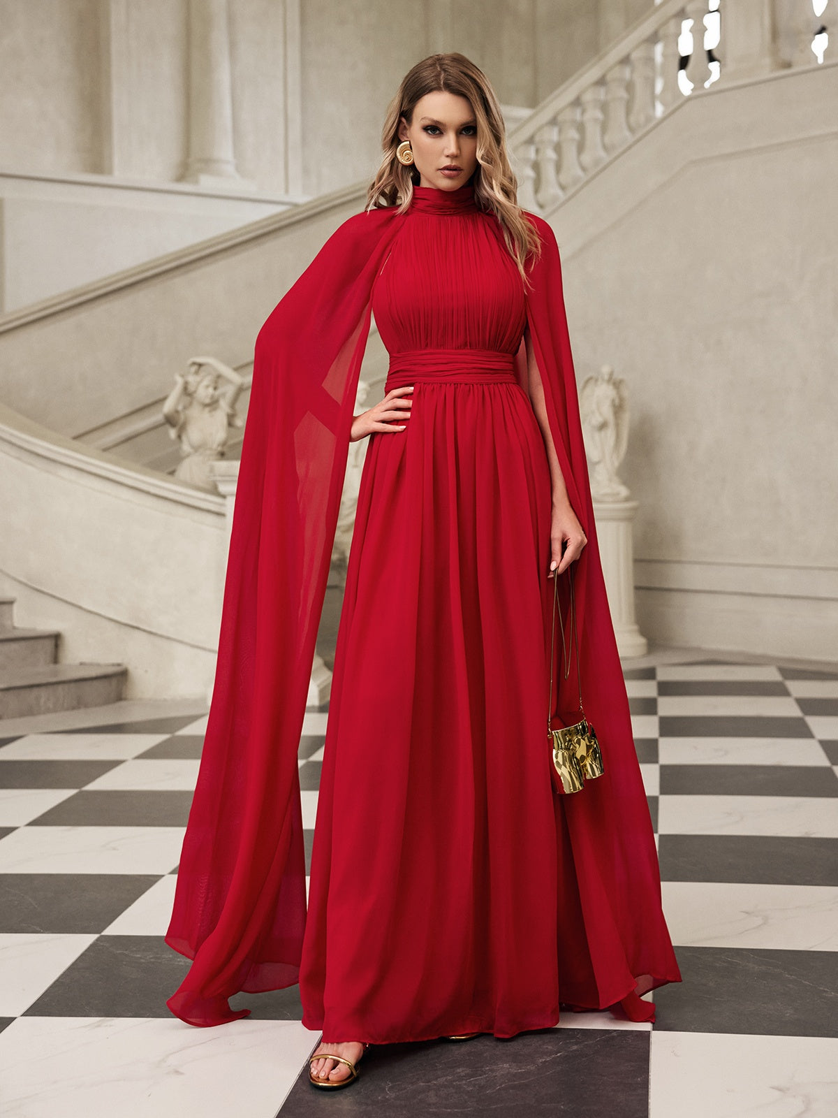 Robe longue en maille à manches cape 