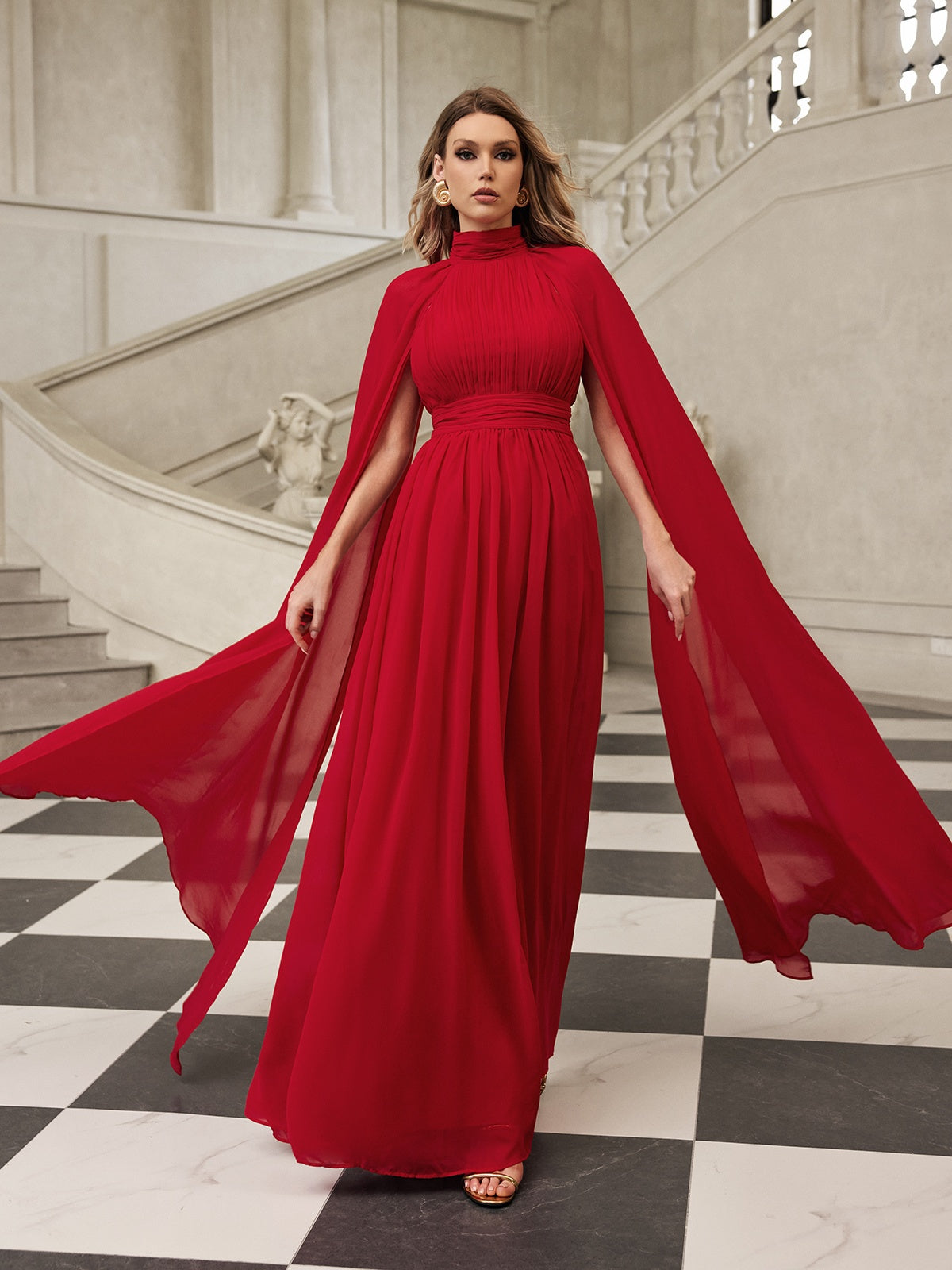 Robe longue en maille à manches cape 