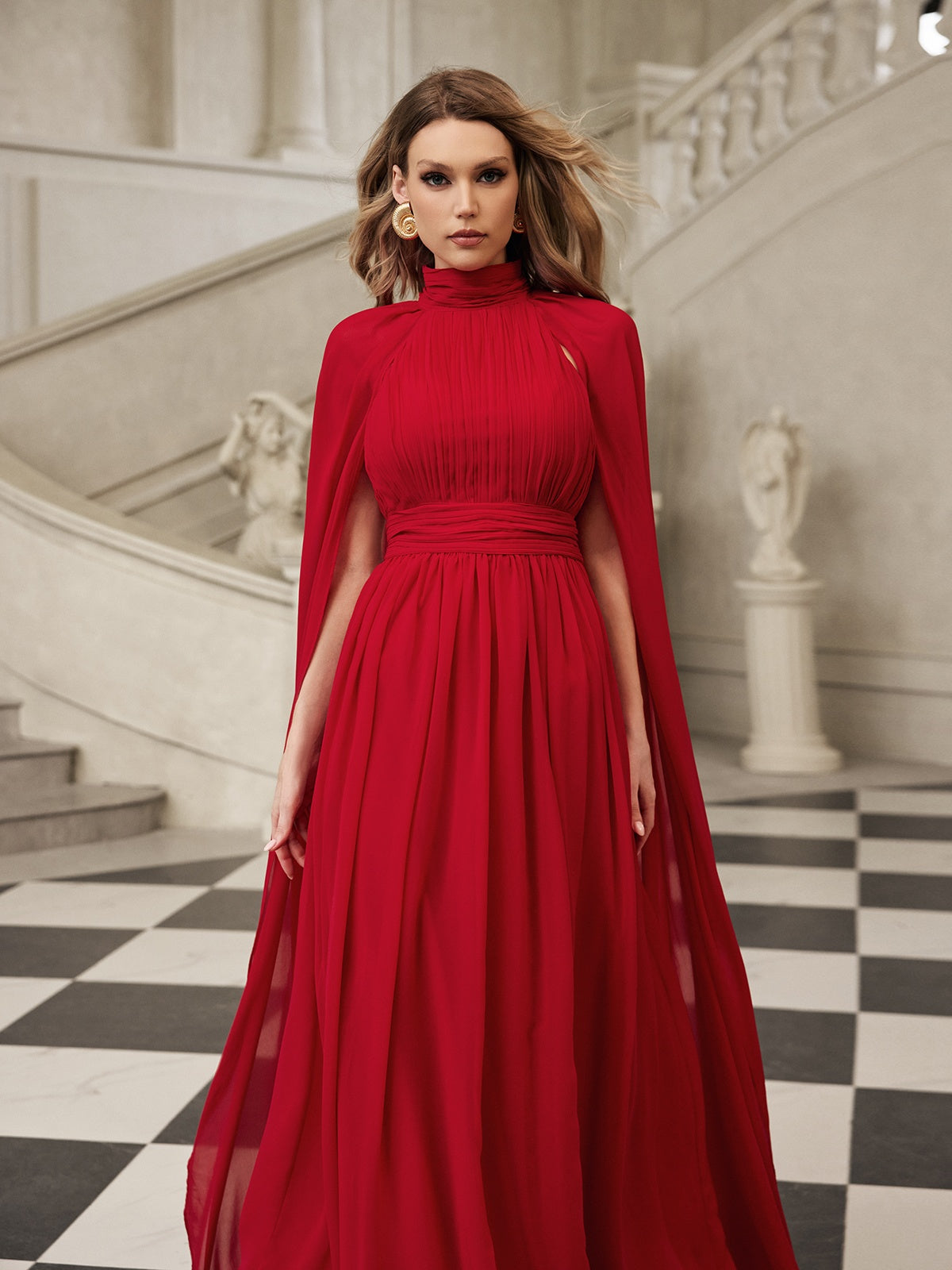 Robe longue en maille à manches cape 