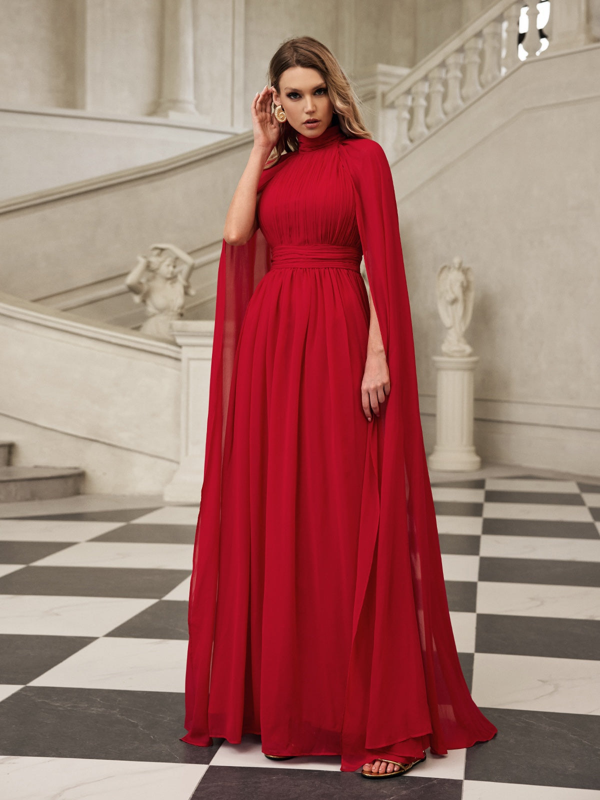 Robe longue en maille à manches cape 