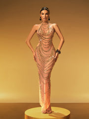 Robe longue dos nu ornée de strass dorés