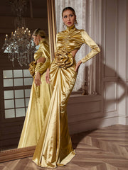 Robe longue dorée à manches longues et découpes florales 